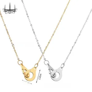 Detail of 47.5cm gold and silver handcuff pendants with polished O-link chain links
