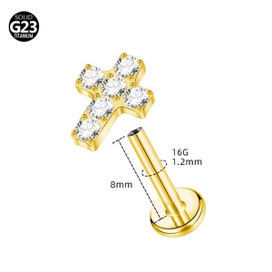 Detail showing 16G 1.2mm x 8mm G23 titanium gold cross labret with internal thread