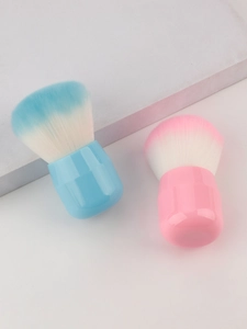 Detail of mini mushroom foundation brushes with soft gradient bristles and portable handles