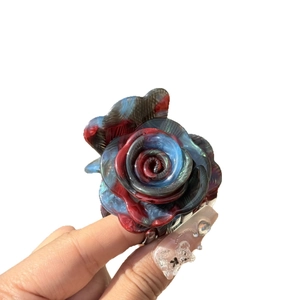 Elegant floral claw clip with blue and red marble resin petals for sweet hairstyles