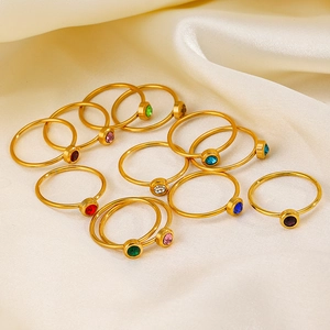 Gold stainless steel stacking rings set with colorful round birthstone crystals