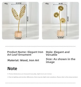 Detail of golden metal leaf ornaments with round wooden bases for home shelf decor