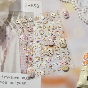 Macro detail of embossed 3D nail stickers featuring cute cat and sweet dessert patterns