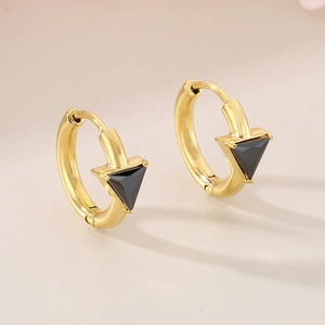 Detail of 18K gold plated hoop earrings featuring a minimalist black triangle inlay