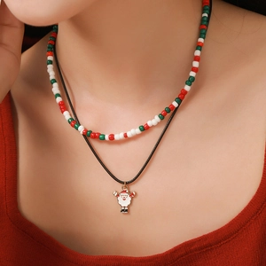 Close-up of double-layer Christmas beaded necklace with Santa Claus pendant and black cord
