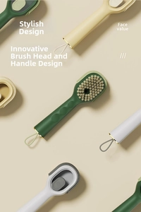 Detail of multi-functional cleaning brushes in green, beige, and grey with soft bristles
