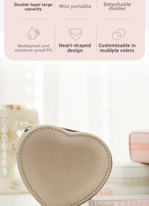 Macro view of beige heart-shaped PU leather jewelry box showing double layer storage