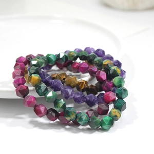 Faceted natural stone beaded bracelets in multi-color crystal and turquoise on a plate