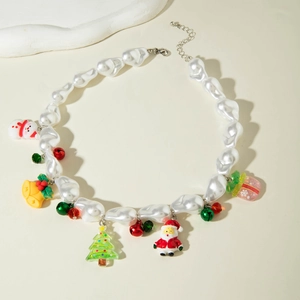 Close-up of Christmas pearl necklace with snowman, bell, and Santa Claus charms