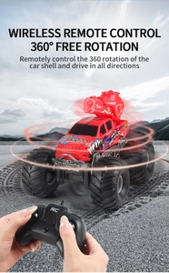 Detail view of red RC monster truck with 360-degree rotating turret and off-road tires
