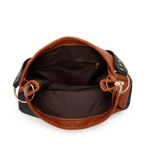 Brown and black patchwork leather tote bag showing spacious interior with zipper pocket