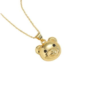Gold bear pendant necklace with black gemstone eyes on polished rope chain jewelry