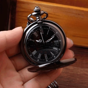 Detail of vintage black pocket watch featuring roman numerals and open metal flip cover