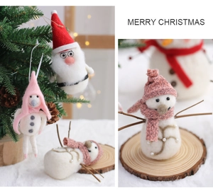 Detail of wool felt Christmas ornaments with Santa and snowman on wooden bases