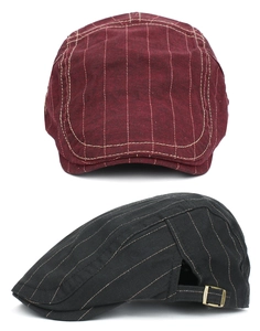 Detail view of cotton striped beret hats with vintage texture and metal side buckles