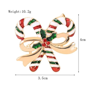 Detail view of candy cane Christmas brooch with red rhinestones and size dimensions
