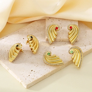 Golden wing earrings set with red, green and black stones and sparkling crystals