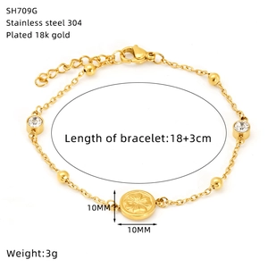 Detail view of 18K gold plated stainless steel bracelet with 10mm sunflower pendant