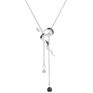 Detail of snake necklace with silver and matte black pendant on long snake bone chains