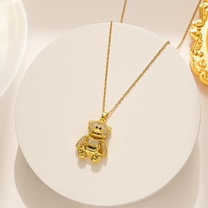 Macro shot of 925 sterling silver stamp on golden teddy bear necklace clasp