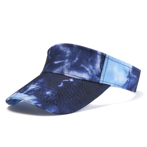 Detail view of colorful tie-dye visor hat with reinforced stitching on curved brim