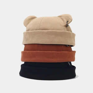 Detail of street style docker hats featuring bear ears and silver rings in three colors