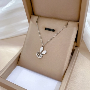 Silver rabbit pendant necklace with hollow Fu character in beige jewelry box
