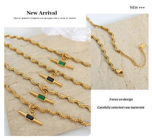 Detail view of gold twisted rope necklaces featuring T-bar pendants with rectangular gems