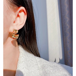 Minimalist gold twisted wavy earrings for women with a stylish crumpled metal design