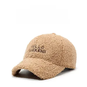 Close-up of thick khaki faux shearling baseball cap with HELLO WEEKEND embroidery