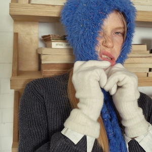 Winter thermal thick wool blend knit gloves for women in white shown on a female model