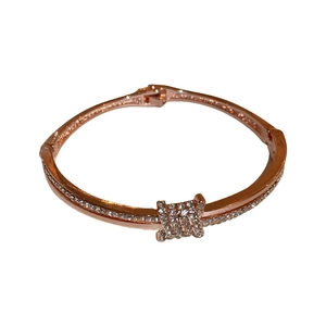Elegant rose gold plated bangle featuring a sparkling rhinestone knotted mesh design