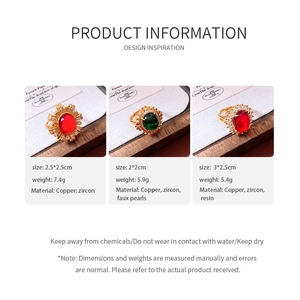 Detailed view of three vintage-style copper rings with pearls and gemstones