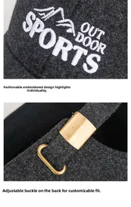 Detailed view of the wool baseball cap featuring mountain embroidery and metal buckle
