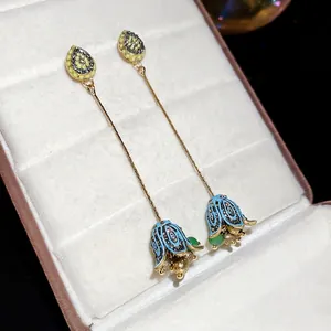 Elegant lily of the valley earrings with blue enamel petals and golden floral tassels