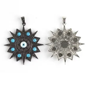 Macro detail of octagonal Evil Eye pendant showing intricate black plating and turquoise beads