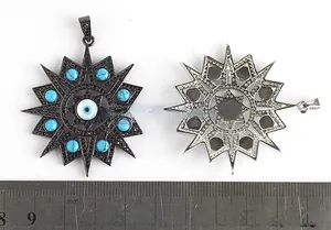 Macro detail of octagonal Evil Eye pendant showing intricate black plating and turquoise beads