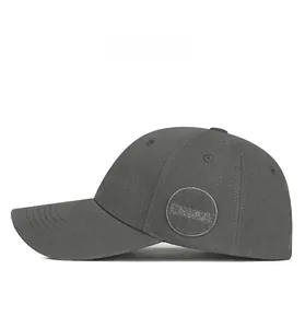Detail view of a dark grey baseball cap with round CHINA embroidery on the side