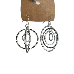 Silver circular layered tiered drop earrings with textured hammered finish on white background