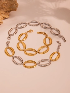 Detailed macro view of S925 oval link chains in gold and silver finish with engraving