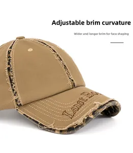 Detailed view of distressed khaki baseball cap with leopard print and wide foldable brim