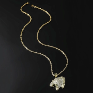Golden hip-hop tiger head pendant necklace with stones and twist chain on black base