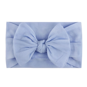 Soft nylon baby headband featuring a large light blue ribbed knit bow for infant girls
