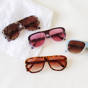 Fashionable oversized oval sunglasses in leopard, tortoiseshell, and gradient colors