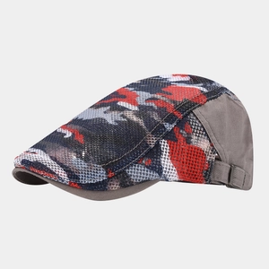 Close-up of breathable camo mesh fabric and adjustable metal buckle on red camouflage cap