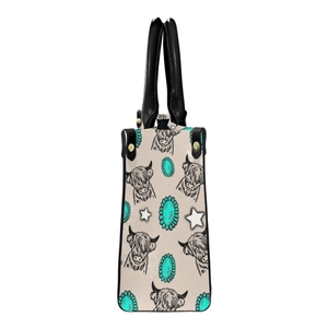 Side view of bohemian cream PU leather tote bag with cattle print and turquoise details