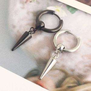 Detailed macro shot of black and silver punk hoop earrings with pointed cone pendants