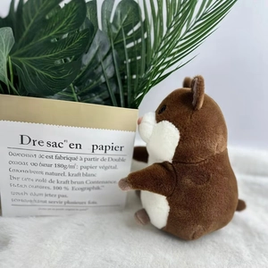 Detailed side view of the brown and white plush hamster toy on a soft white faux fur rug