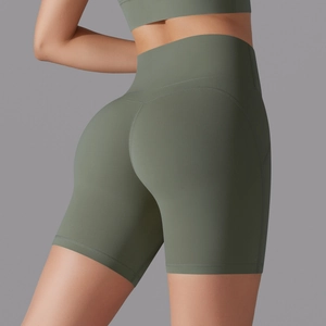Close-up of high-waisted seamless biker shorts showing compression and lifting effect