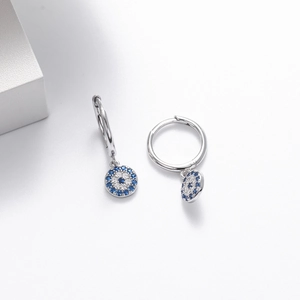 Detail of S925 sterling silver evil eye earrings with blue cubic zirconia stones